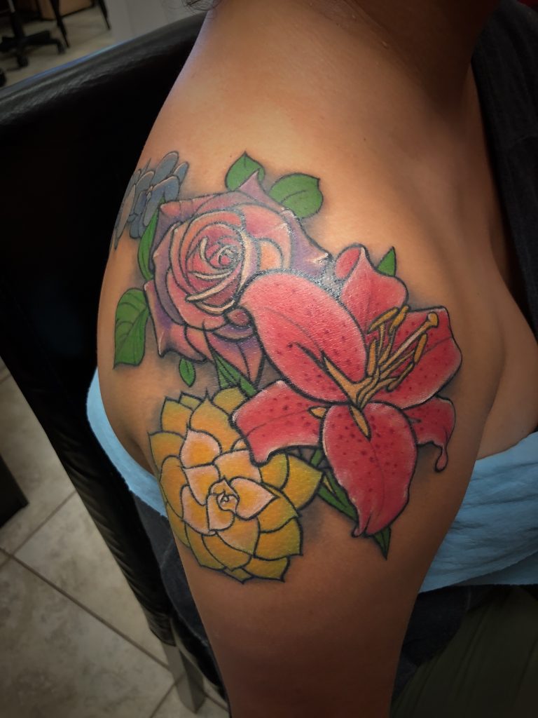 Floral Sleeve by Spiro at Artistic Impressions Tattoo Studio located in Katy,Texas