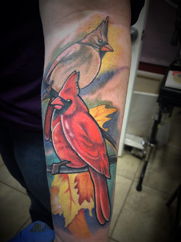 Cardinal Pair by Spiro at Artistic Impressions Tattoo Studio located in Katy, Texas