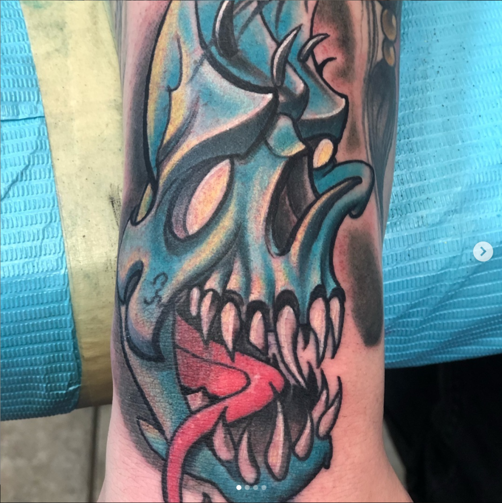 Blue Skull by Spiro at Artistic Impressions Tattoo Studio located in Katy, Texas