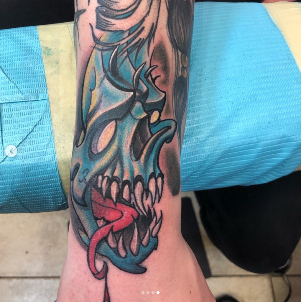 Blue Skull by Spiro at Artistic Impressions Tattoo Studio located in Katy, Texas