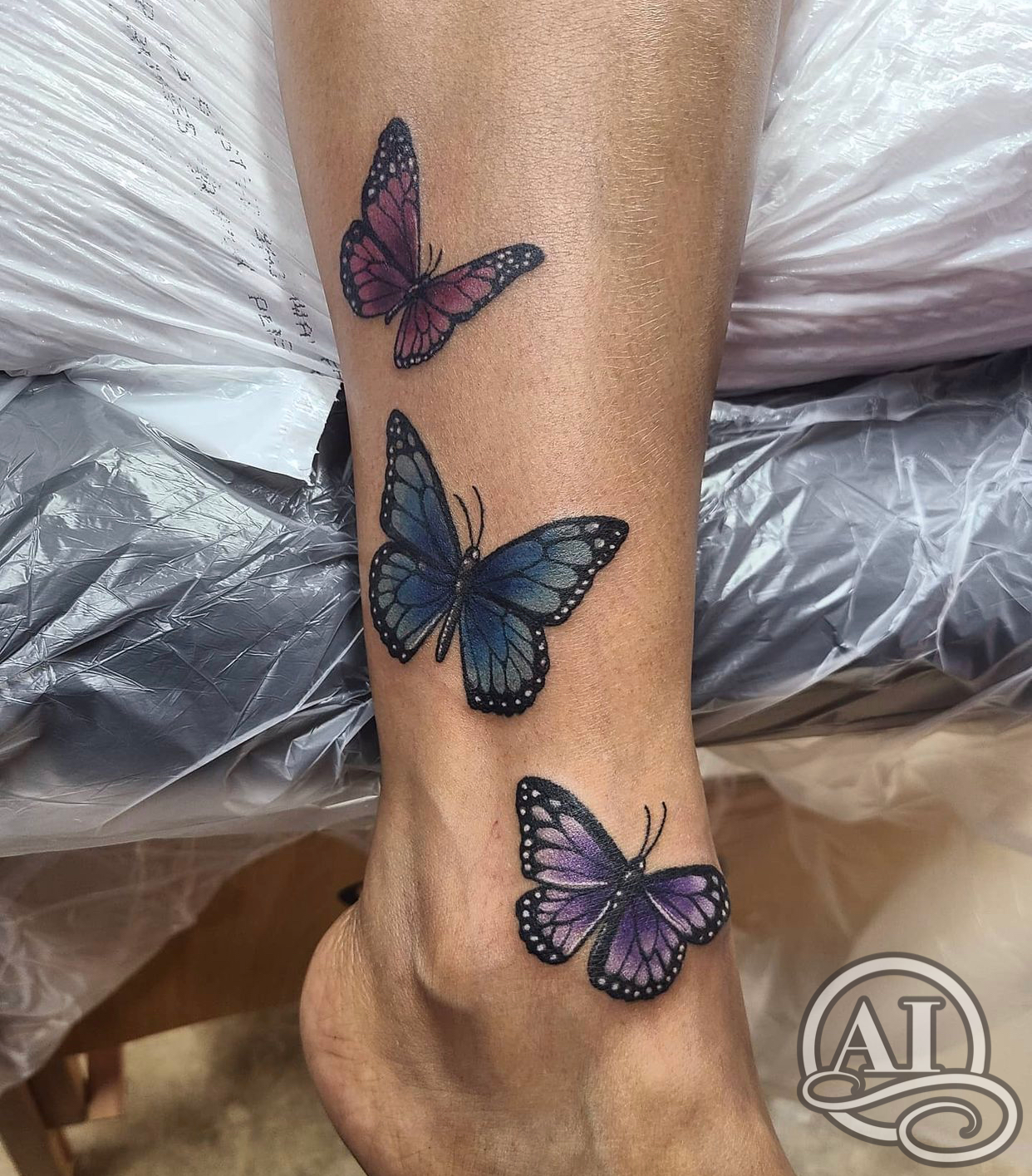 butterfly tattoo on lower leg