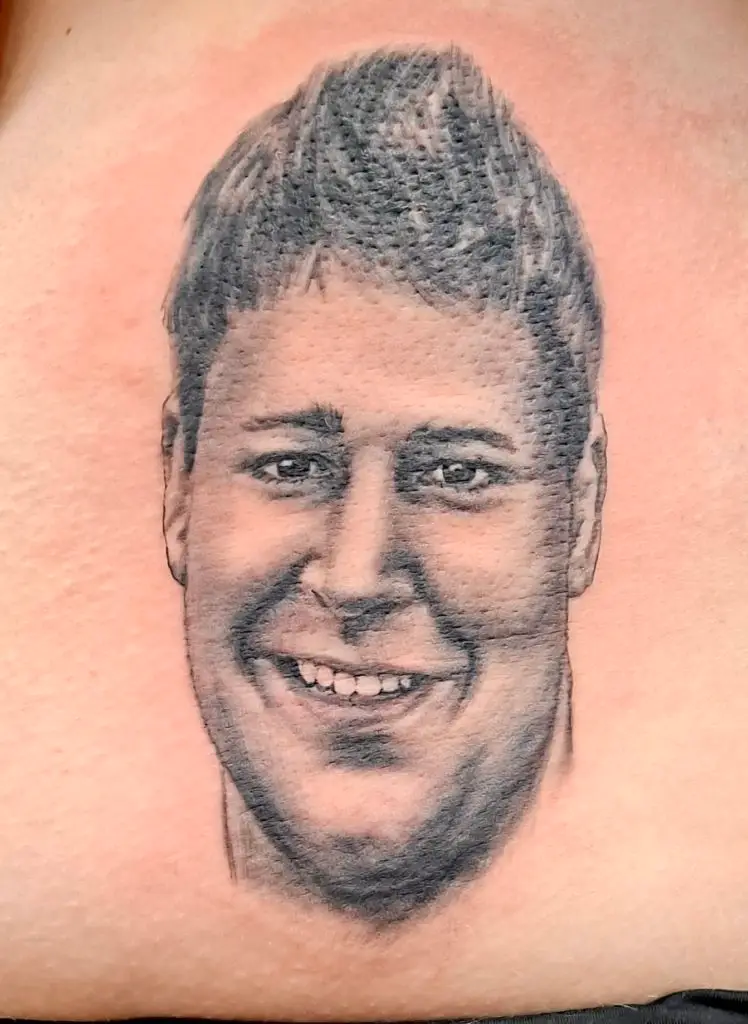 a tattoo of a portrait by Mike at Artistic Impressions Tattoo Studio in Katy, Texas