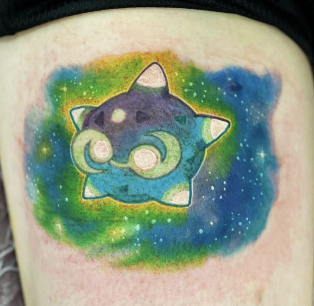 a tattoo of a Pokémon design by Mark Anthony at Artistic Impressions Tattoo Studio in Katy, Texas