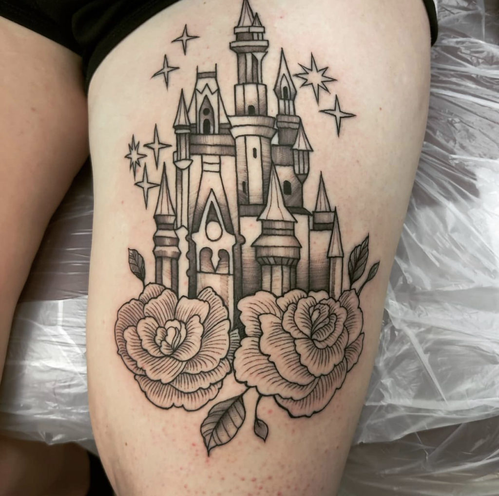 a tattoo of a Walt Disney castle on the leg by Mark Anthony at Artistic Impressions Tattoo Studio in Katy, Texas