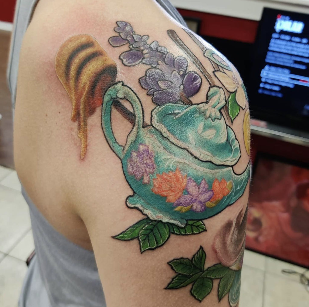 a tattoo of a teapot by Mark Anthony at Artistic Impressions Tattoo Studio in Katy, Texas