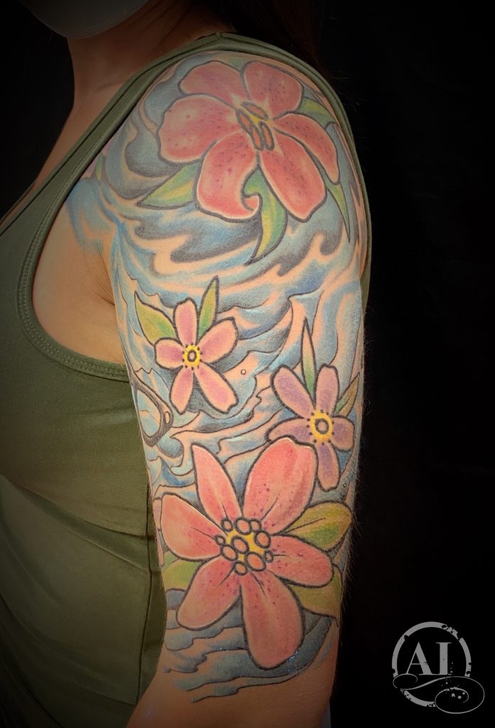 Water and flowers by Spiro at Artistic Impressions Tattoo Studio located in Katy, Texas