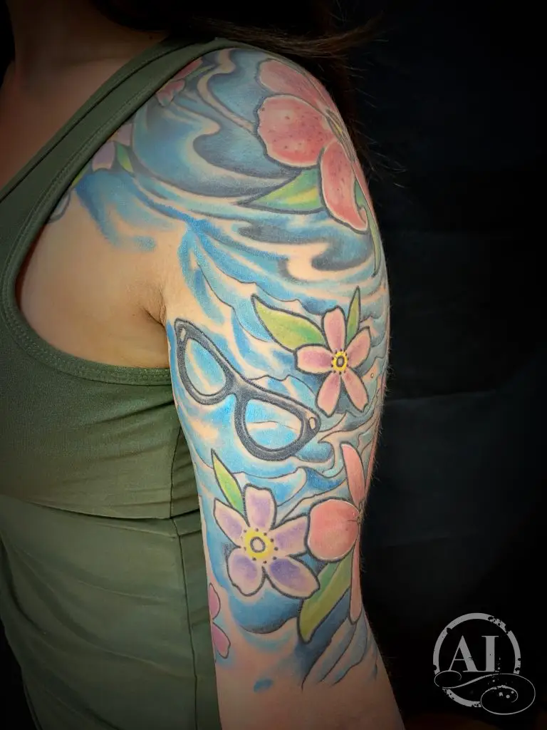 Water and flowers by Spiro at Artistic Impressions Tattoo Studio located in Katy, Texas