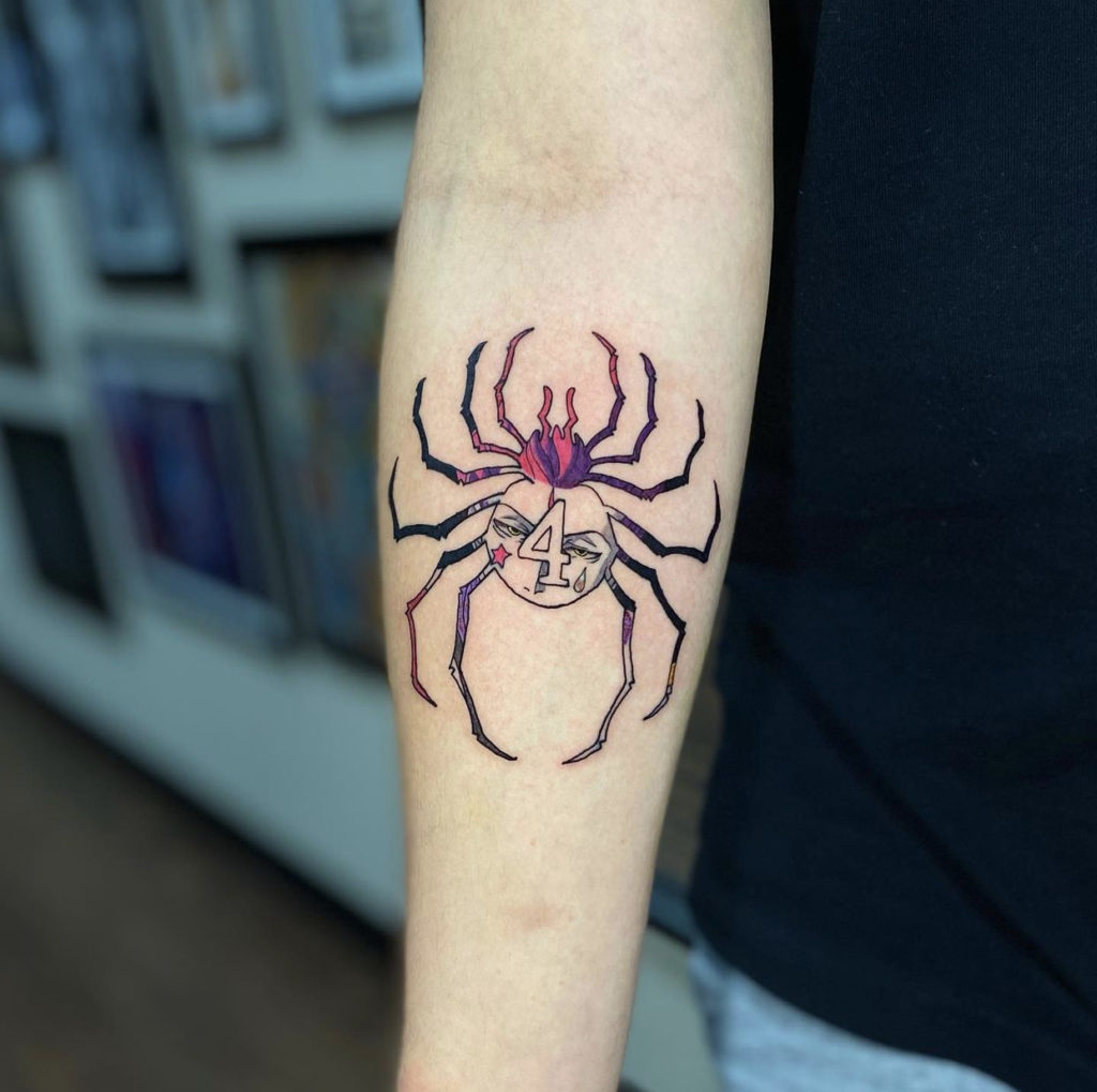 a spider tattoo by Nick at Artistic Impressions Tattoo Studio in Katy,Texas