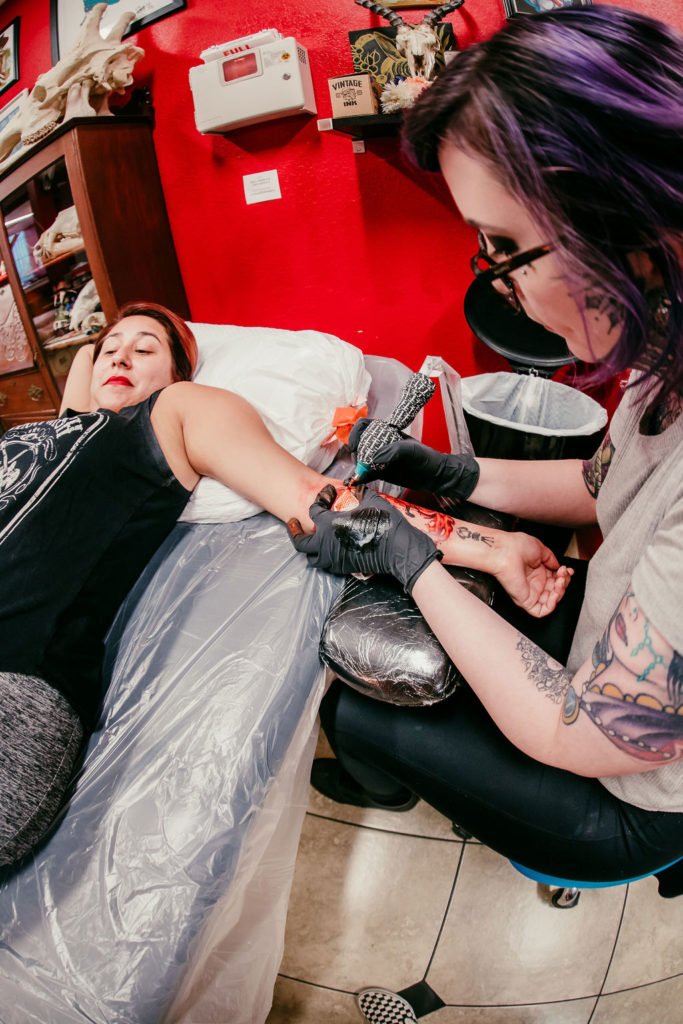 Sammy Gates tattooing at Artistic Impressions Tattoo Studio in Cypress, Texas