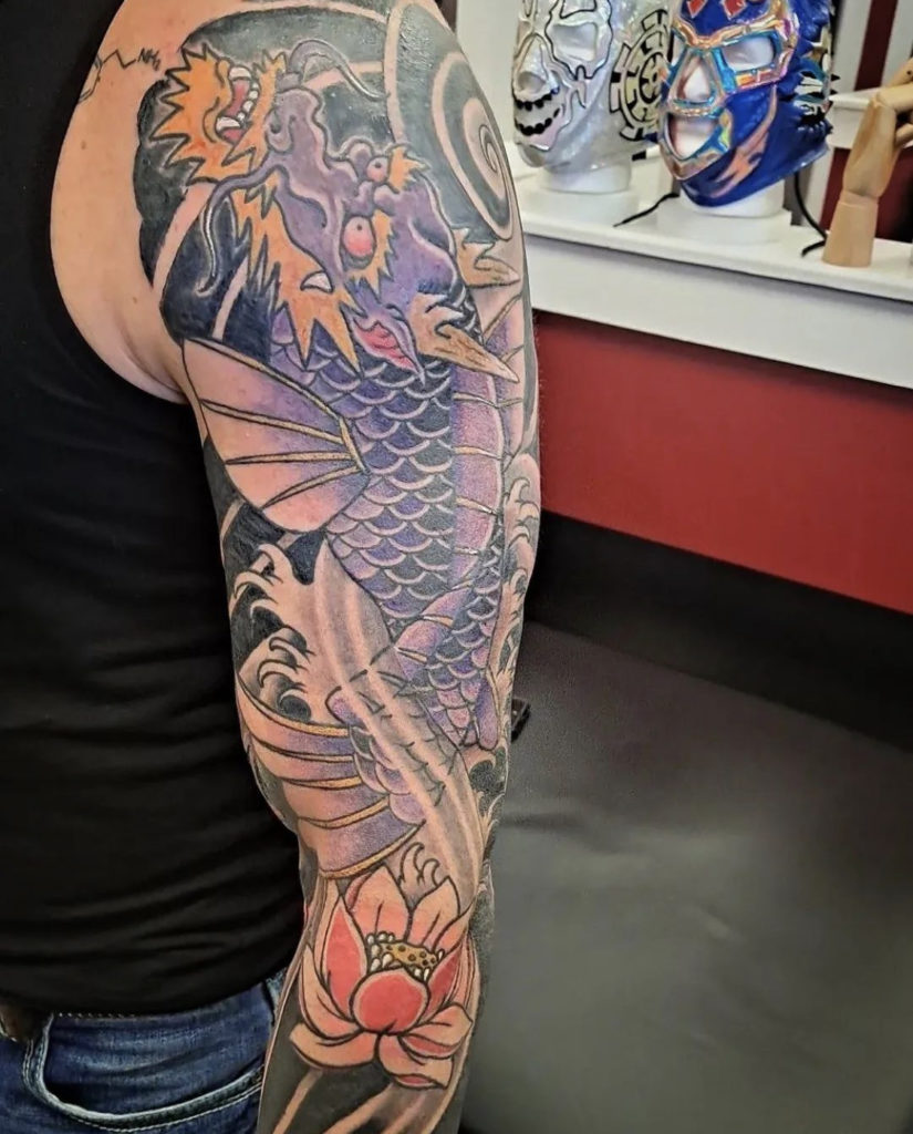 A Japanese tattoo of a Dragon Koifish by Mike Valadez at Artistic Impressions Tattoo Studio in Katy, Texas