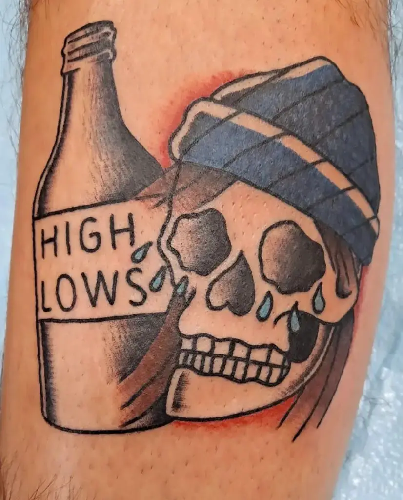 a traditional tattoo of a skull with booze by Mike Valadez at Artistic Impressions Tattoo Studio in Katy, Texas