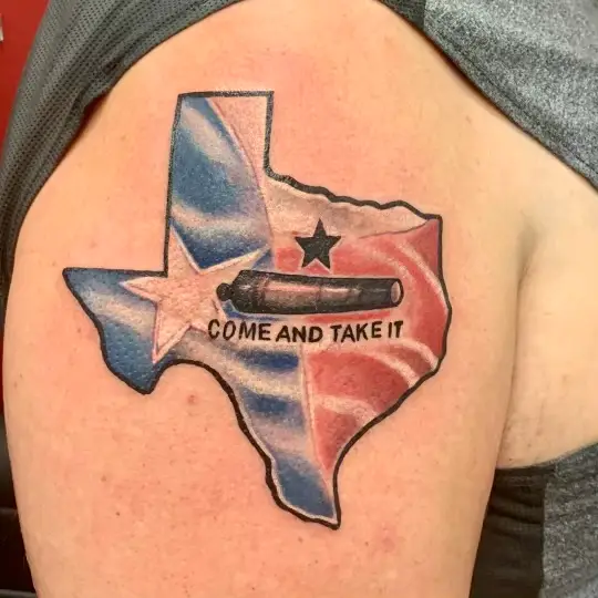 a tattoo of Texas with "Come and take it" theme by Ulisses at Artistic Impressions Tattoo Studio in Katy, Texas