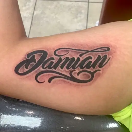 a tattoo of lettering by Ulisses at Artistic Impression Tattoo Studio in Katy, Texas