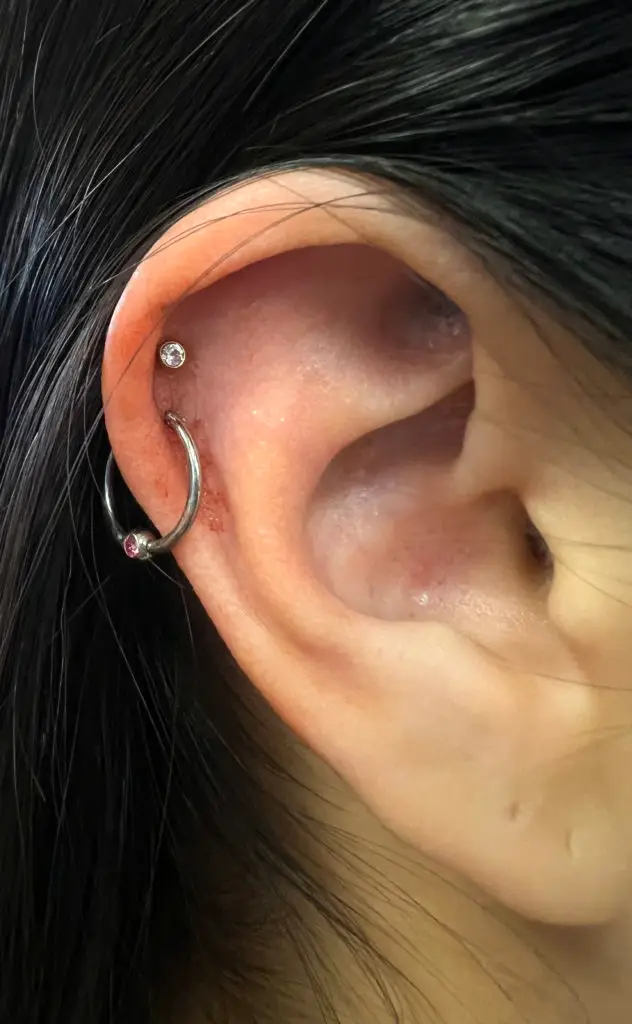 Ear piercing by Cadin Rose at Artistic Impressions Tattoo Studio located in Katy, Texas