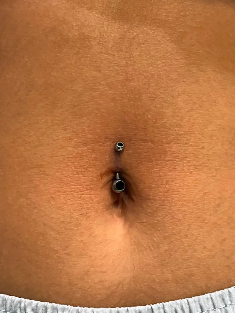 Navel piercing by Cadin Rose at Artistic Impressions Tattoo Studio located in Katy, Texas