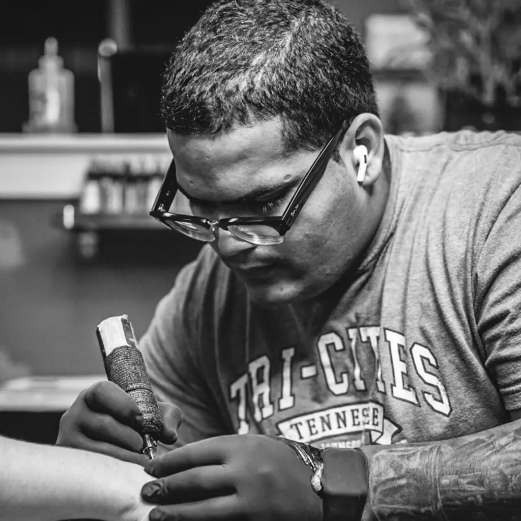 David Noy tattooing at Artistic Impressions Tattoo Studio located in Katy, Texas. The best tattoo studio in Katy, Texas.