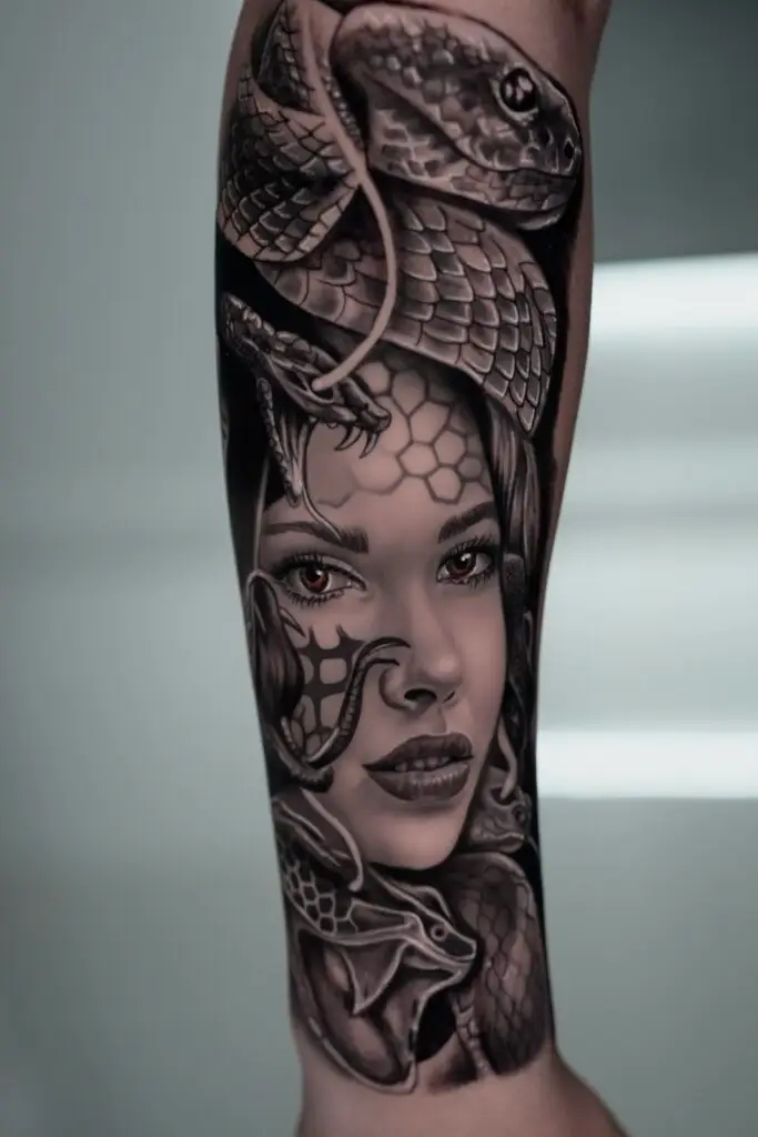 Gabriel tattooed this face with a snake at Artistic Impressions Tattoo Studio in Katy, Texas