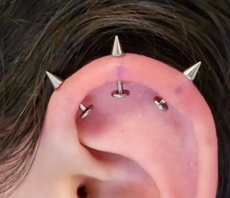 Shelby's ear piercing at Artistic Impressions Tattoo Studio in Sugarland, Texas