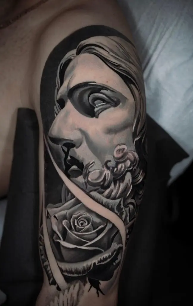 Gabriel tattooed this rose and face tattoo at Artistic Impressions Tattoo Studio in Katy, Texas