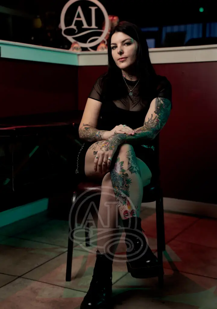 Allyson a tattoo artist at Artistic Impressions Tattoo Studio in Cypress, Texas