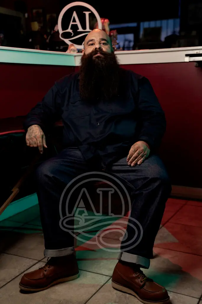 Biggie making high quality tattoos at Artistic Impression Tattoo Studio in Cypress, Texas